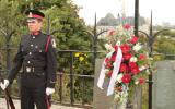 2012 Memorial Service - Officer standing at attention with wreath (1)
