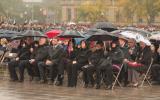2012 Memorial Service - guests at memorial service in the rain with umbrellas (6)